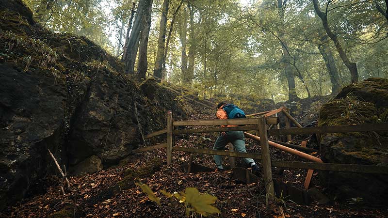 Man hiking in woods - fasteners for outdoor products