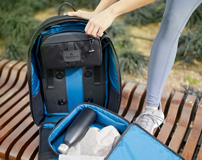 The opened Milano backpack with visible modules and SNAP fasteners