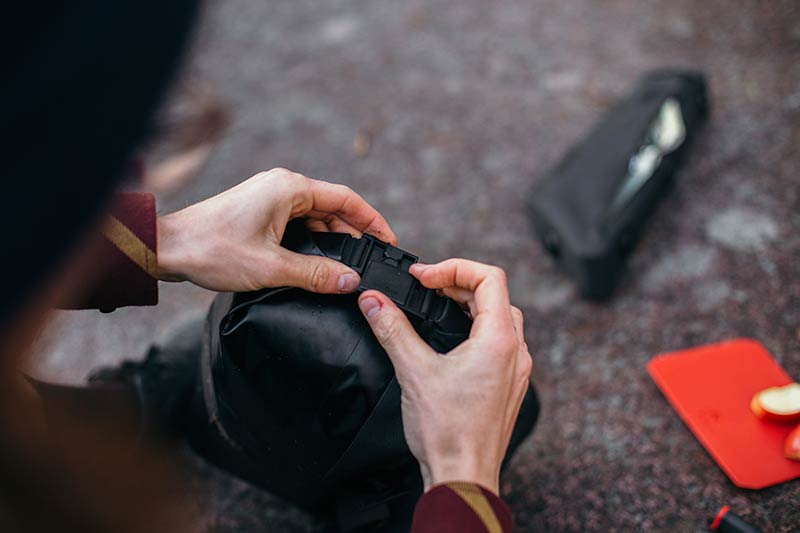 Close-up of the SNAP buckle flat on the handelbar bag of the Fara Cycling bikepacking system