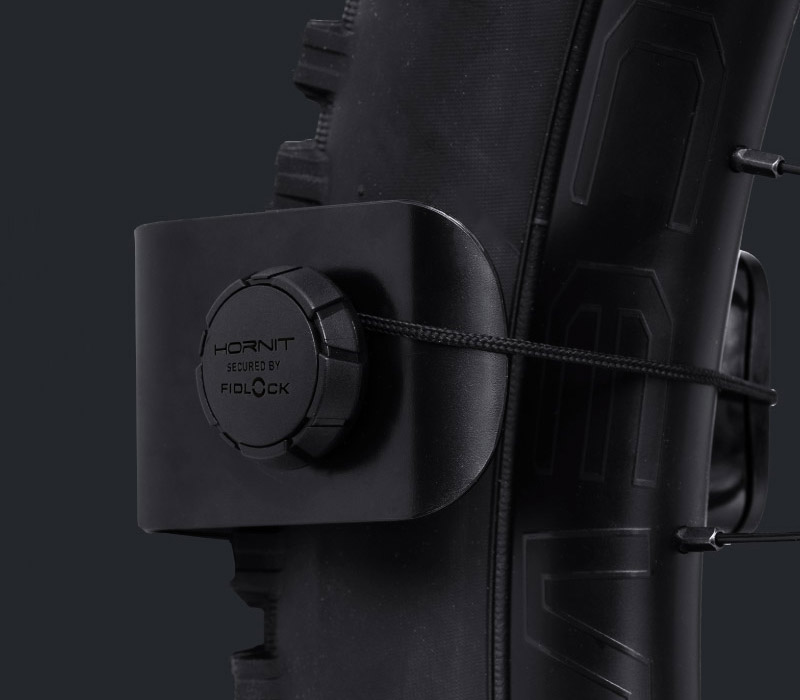 Close-up of tire in CLUG PRO bike rack with FIDLOCK WINCH