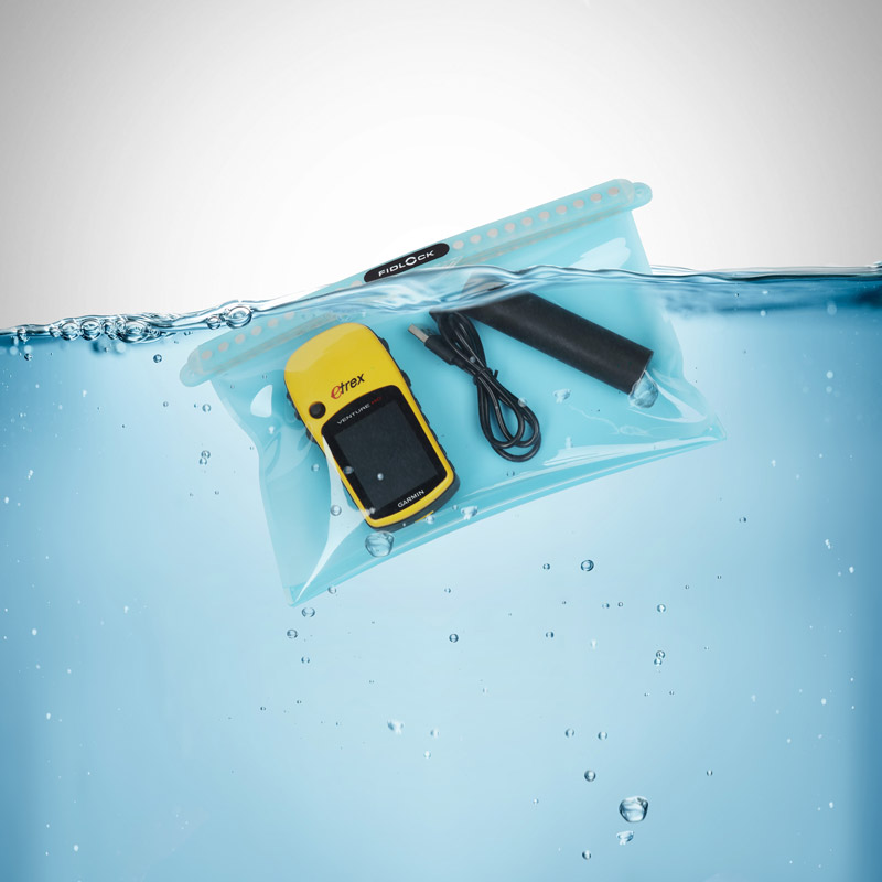 Example of the dry bag multi in transparent and blue floating in water