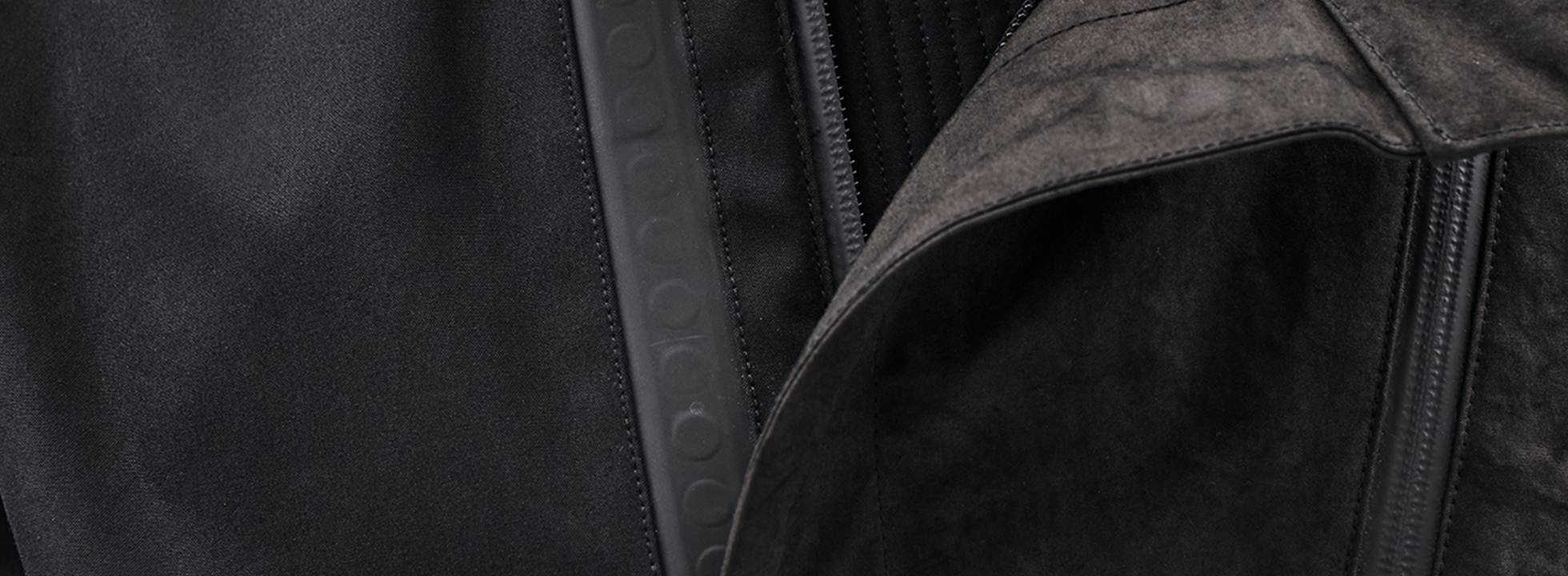 Rain jacket by enfin levé with magnetic bands by FIDLOCK