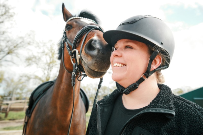 Woman with helmet and horse
