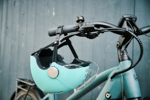 NACA helmet hanging on bike
