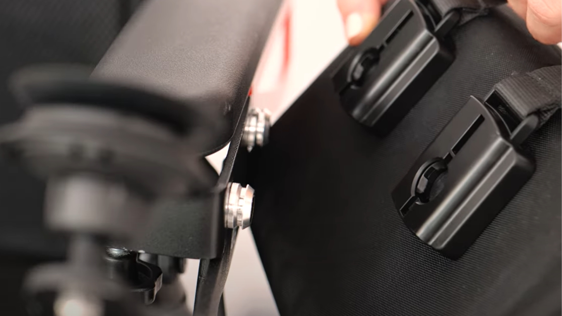 SNAP Pull buckles and SNAP bolts on black bag
